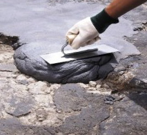 Technician Applying Compound